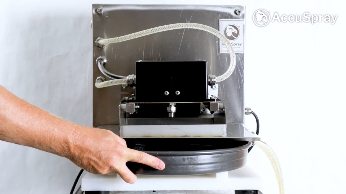 Demonstration of how to oil a pan with the tabletop pan oiler